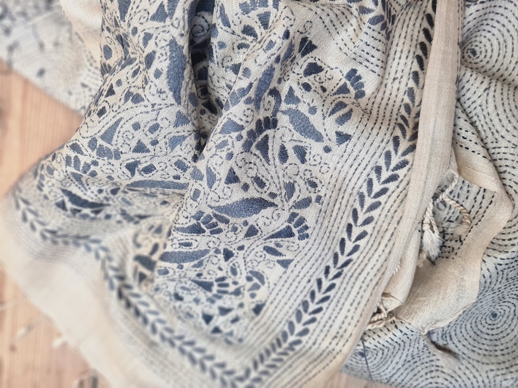 A tussar silk scarf/shawl hand-embroidered with traditional motifs by a NGO in West Bengal.