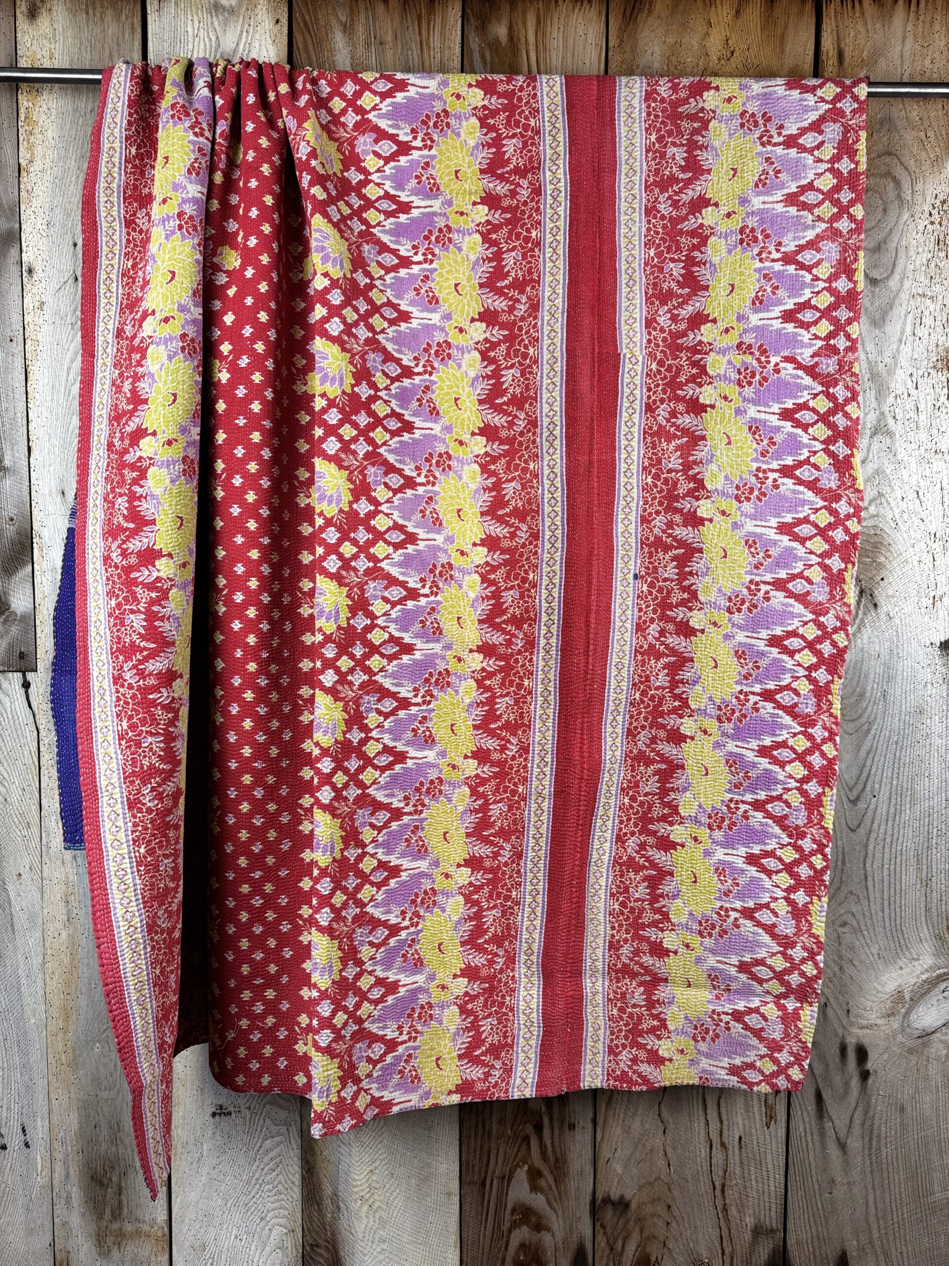 Exquisite vintage Kantha quilt featuring authentic hand-stitched Indian patchwork, responsibly sourced and perfect as unique homeware.