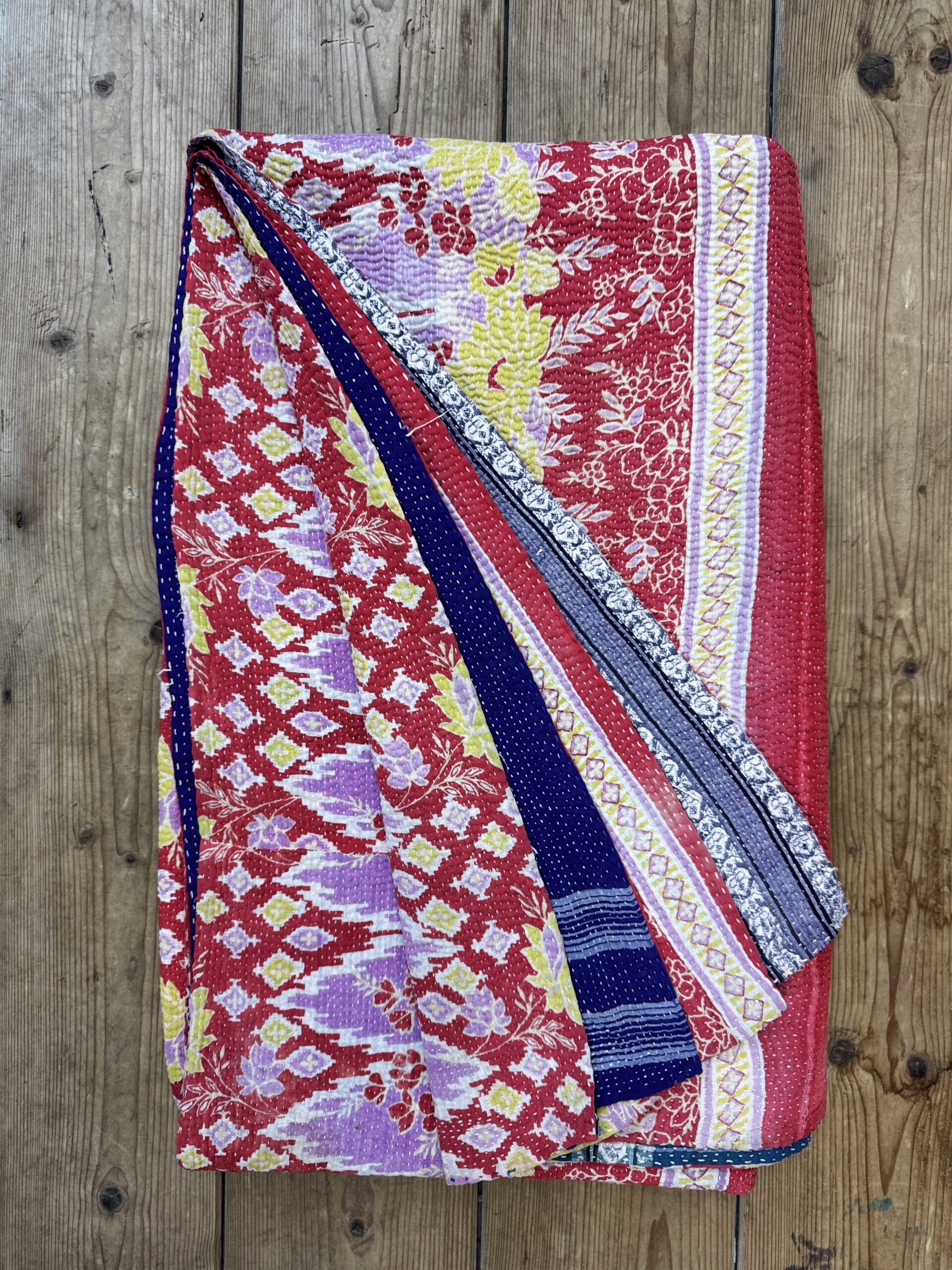 Exquisite vintage Kantha quilt featuring authentic hand-stitched Indian patchwork, responsibly sourced and perfect as unique homeware.