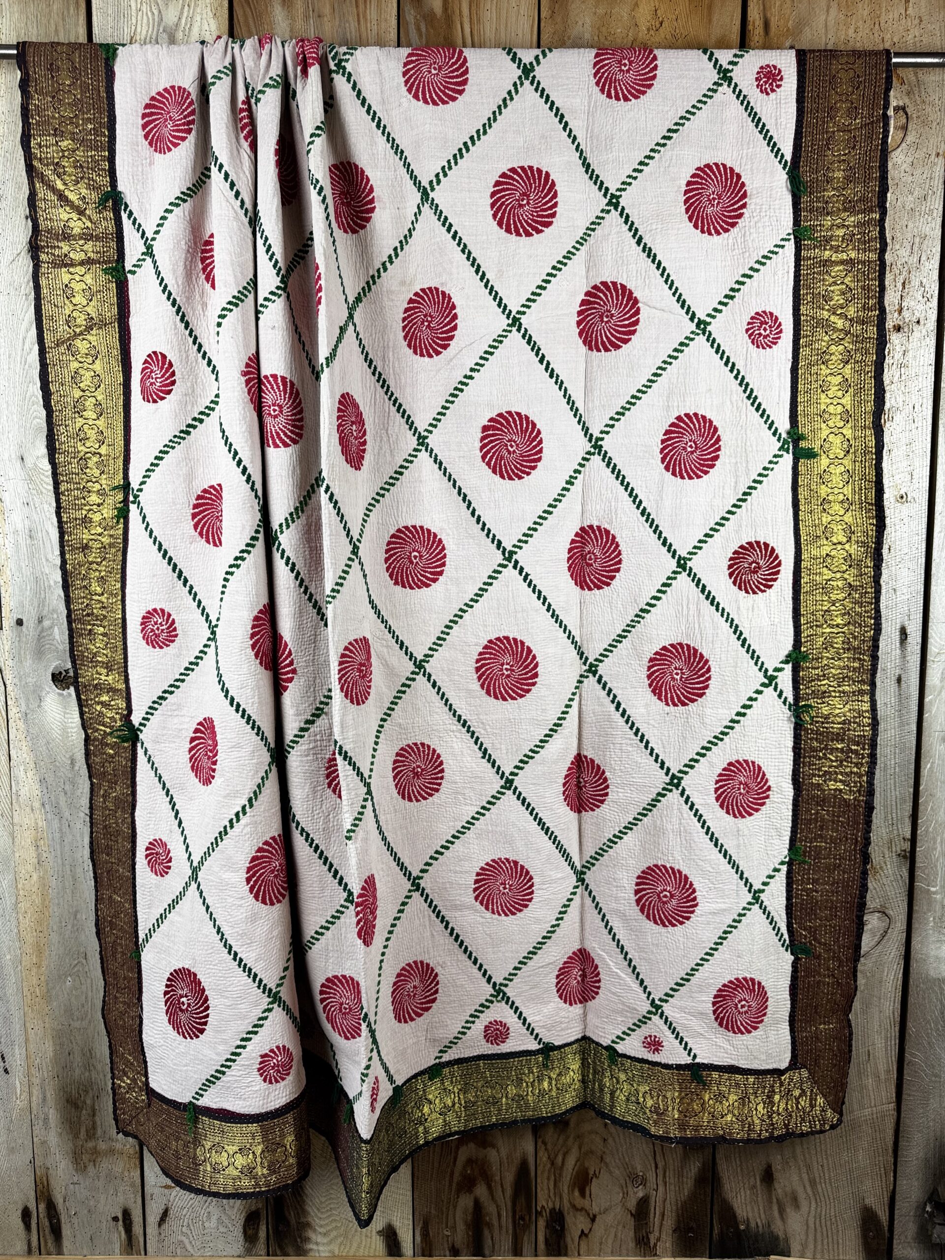 Exquisite vintage Kantha quilt featuring authentic hand-stitched Indian patchwork, responsibly sourced and perfect as unique homeware.