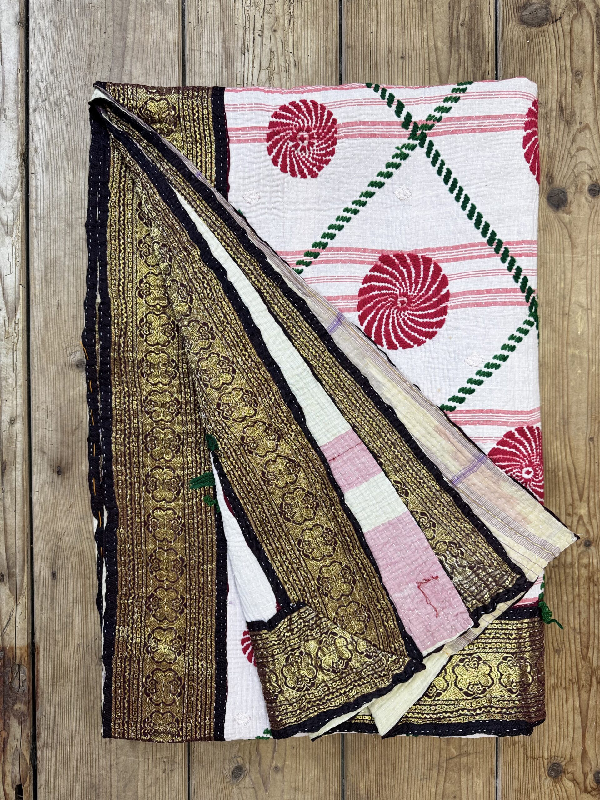 Exquisite vintage Kantha quilt featuring authentic hand-stitched Indian patchwork, responsibly sourced and perfect as unique homeware.