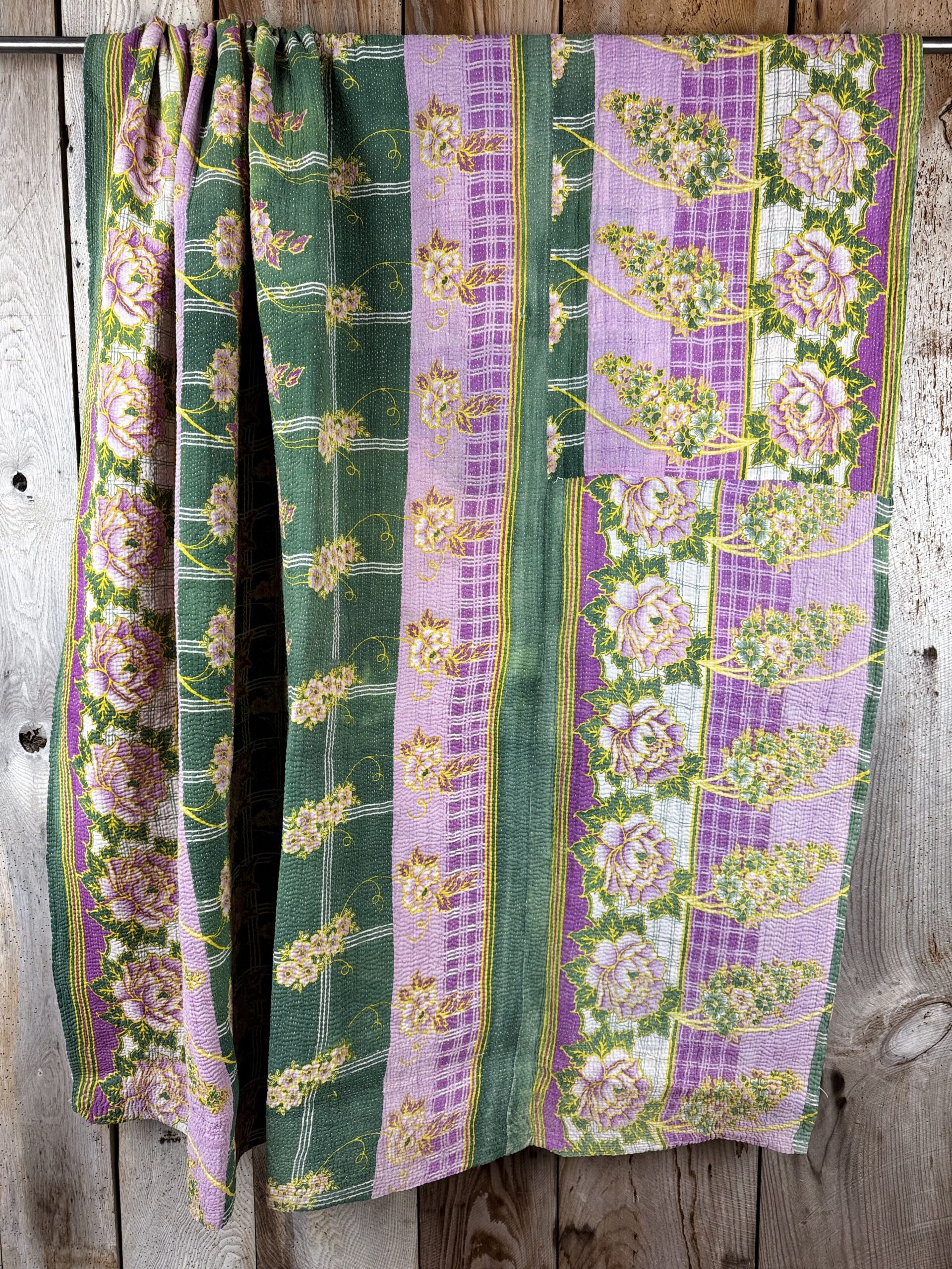 Exquisite vintage Kantha quilt featuring authentic hand-stitched Indian patchwork, responsibly sourced and perfect as unique homeware.