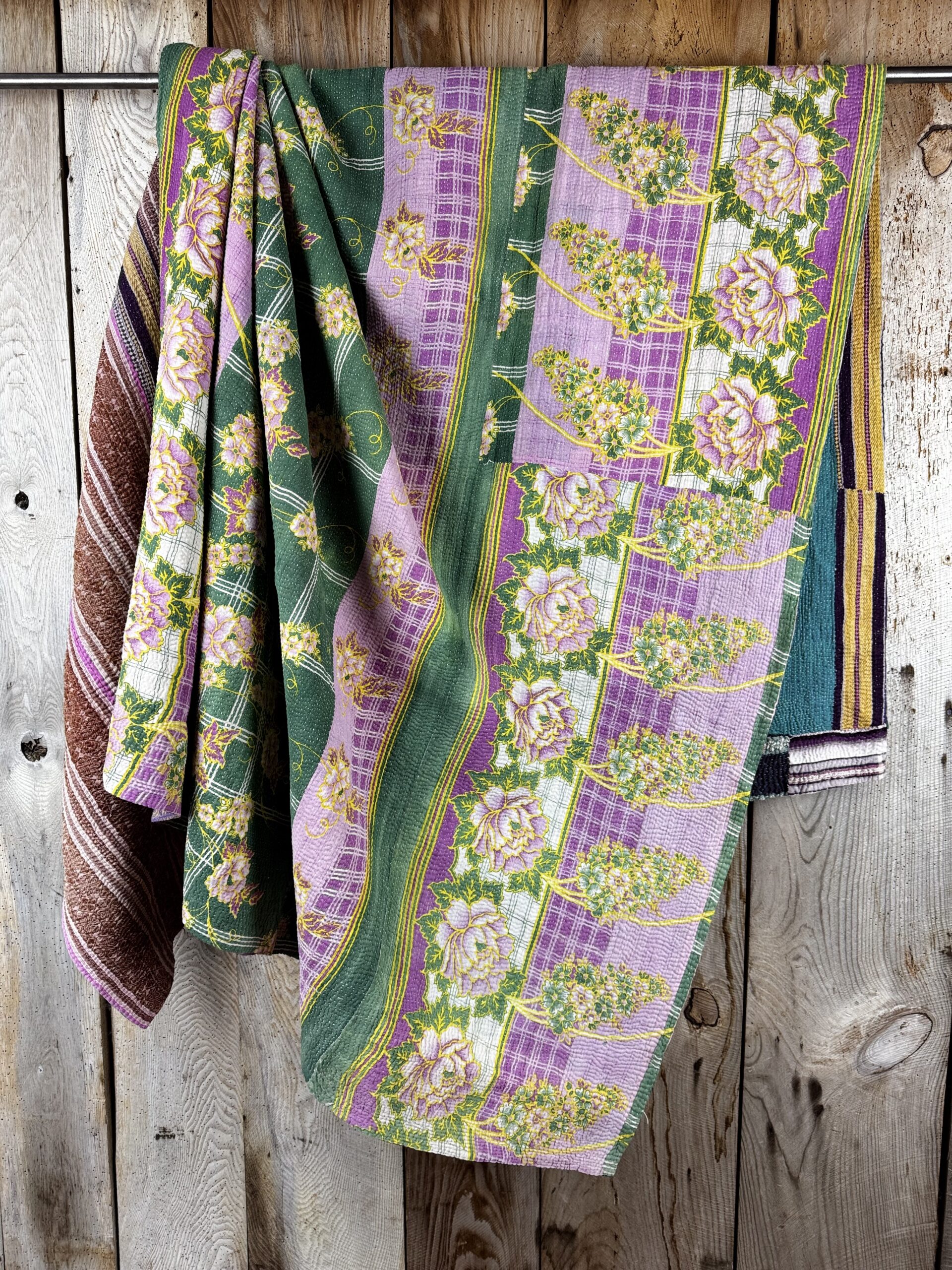 Exquisite vintage Kantha quilt featuring authentic hand-stitched Indian patchwork, responsibly sourced and perfect as unique homeware.