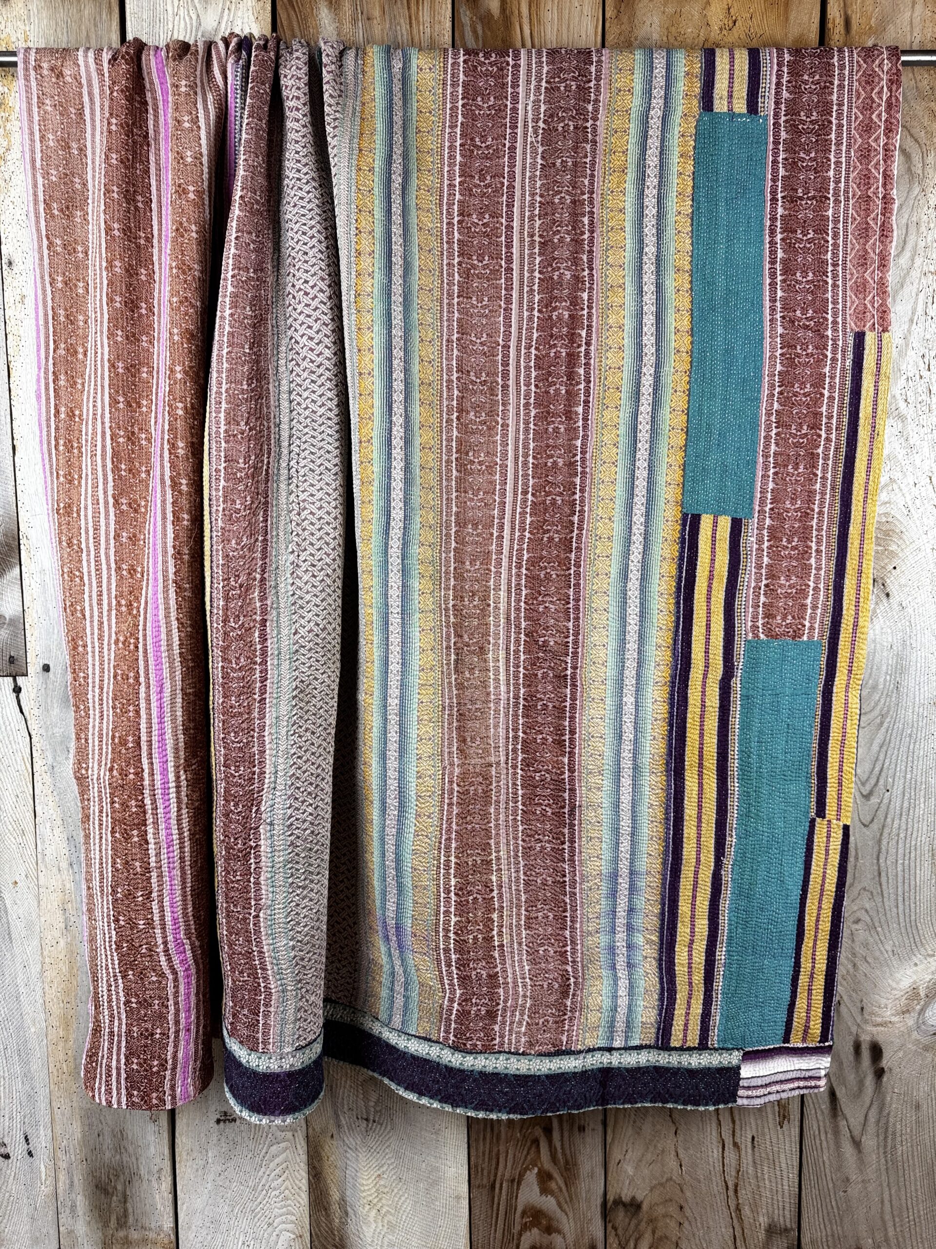 Exquisite vintage Kantha quilt featuring authentic hand-stitched Indian patchwork, responsibly sourced and perfect as unique homeware.