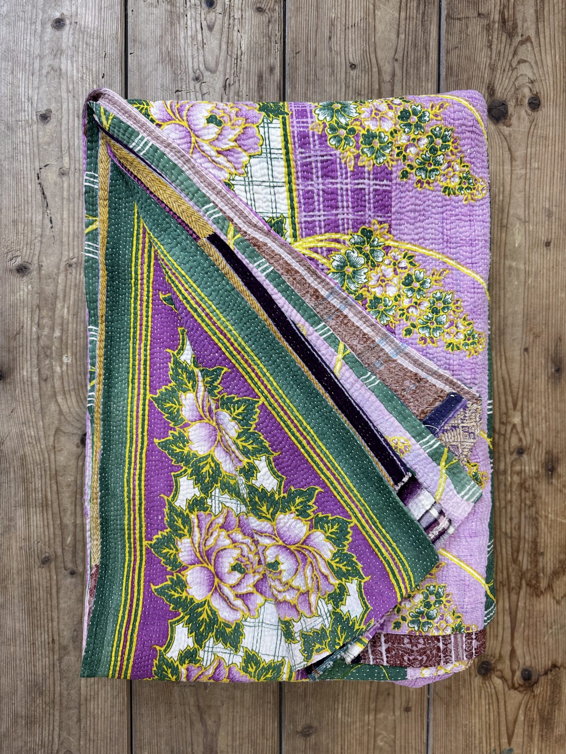 Exquisite vintage Kantha quilt featuring authentic hand-stitched Indian patchwork, responsibly sourced and perfect as unique homeware.