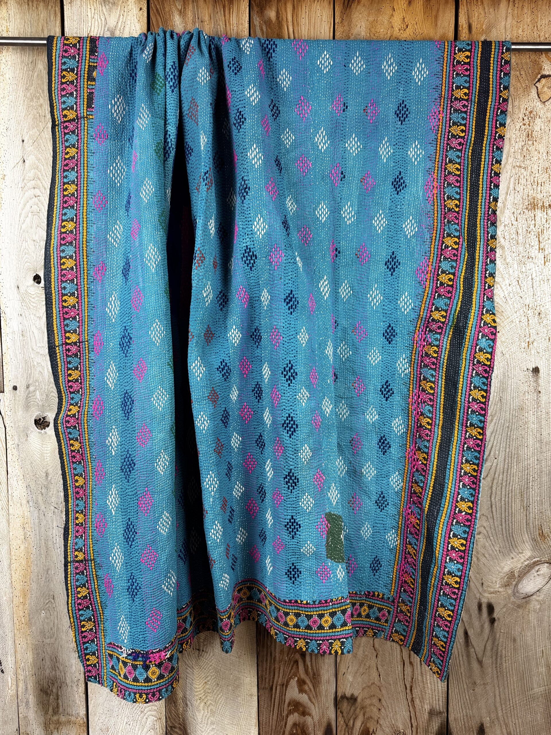 Exquisite vintage Kantha quilt featuring authentic hand-stitched Indian patchwork, responsibly sourced and perfect as unique homeware.