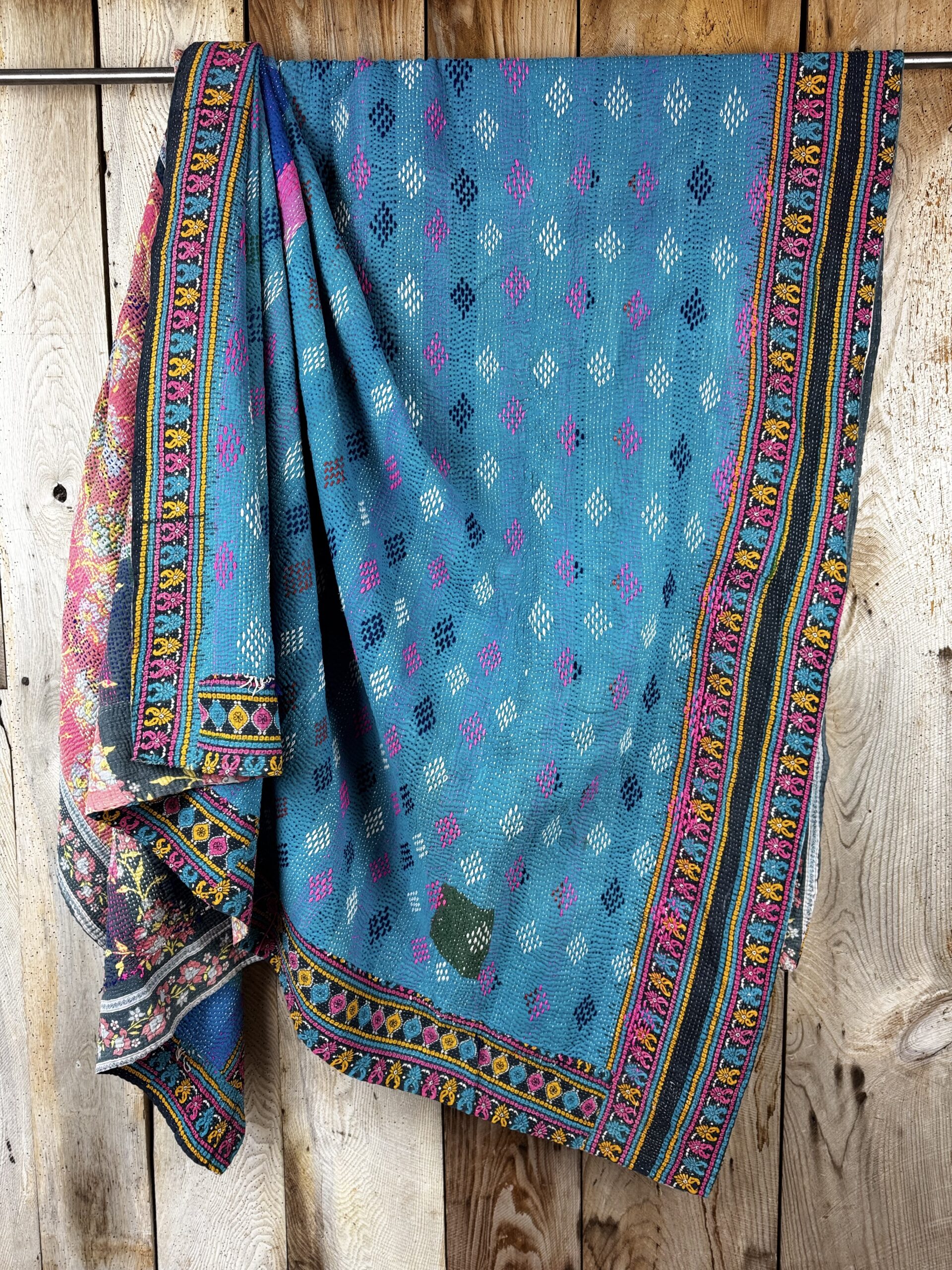 Exquisite vintage Kantha quilt featuring authentic hand-stitched Indian patchwork, responsibly sourced and perfect as unique homeware.