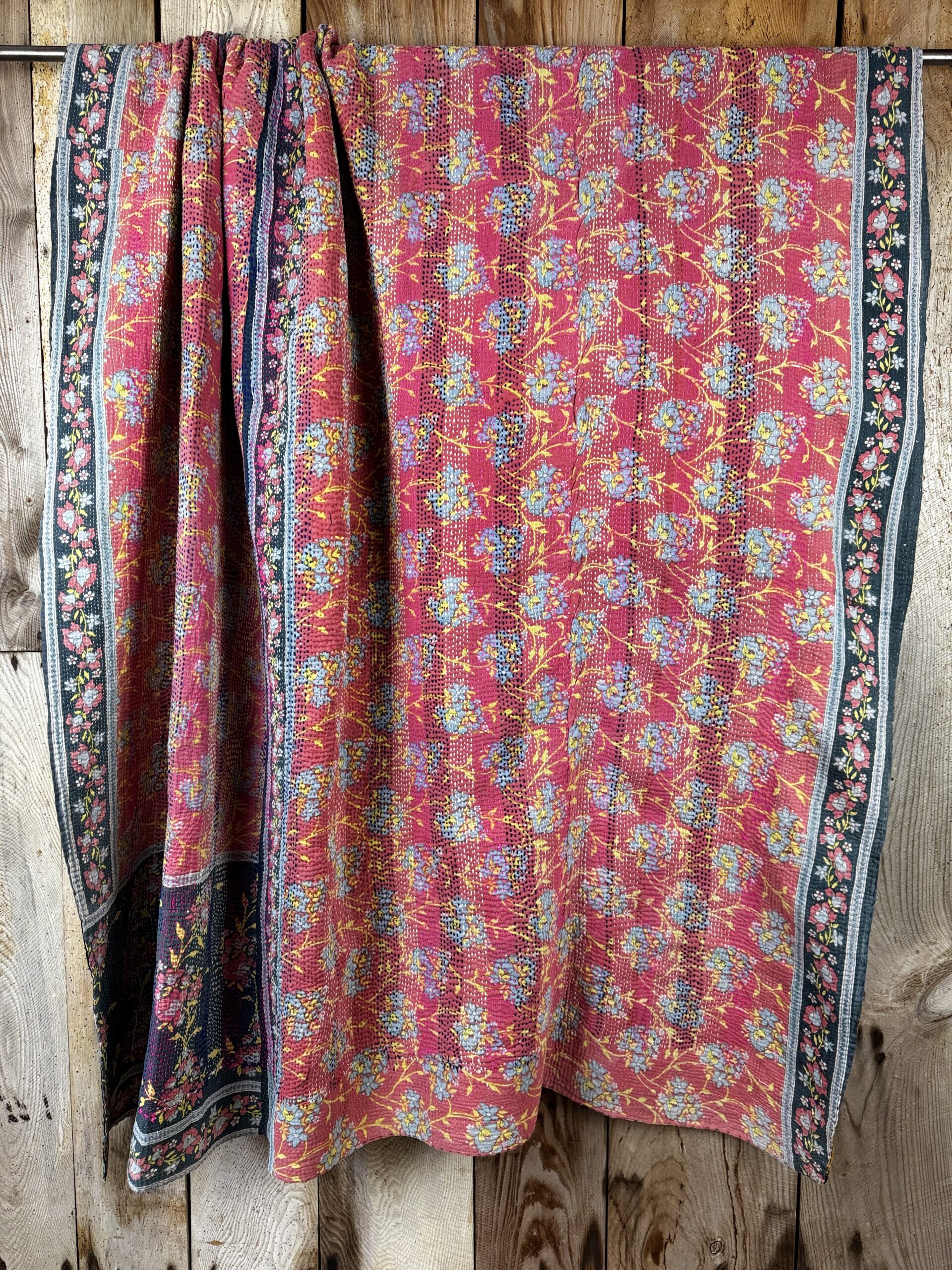 Exquisite vintage Kantha quilt featuring authentic hand-stitched Indian patchwork, responsibly sourced and perfect as unique homeware.