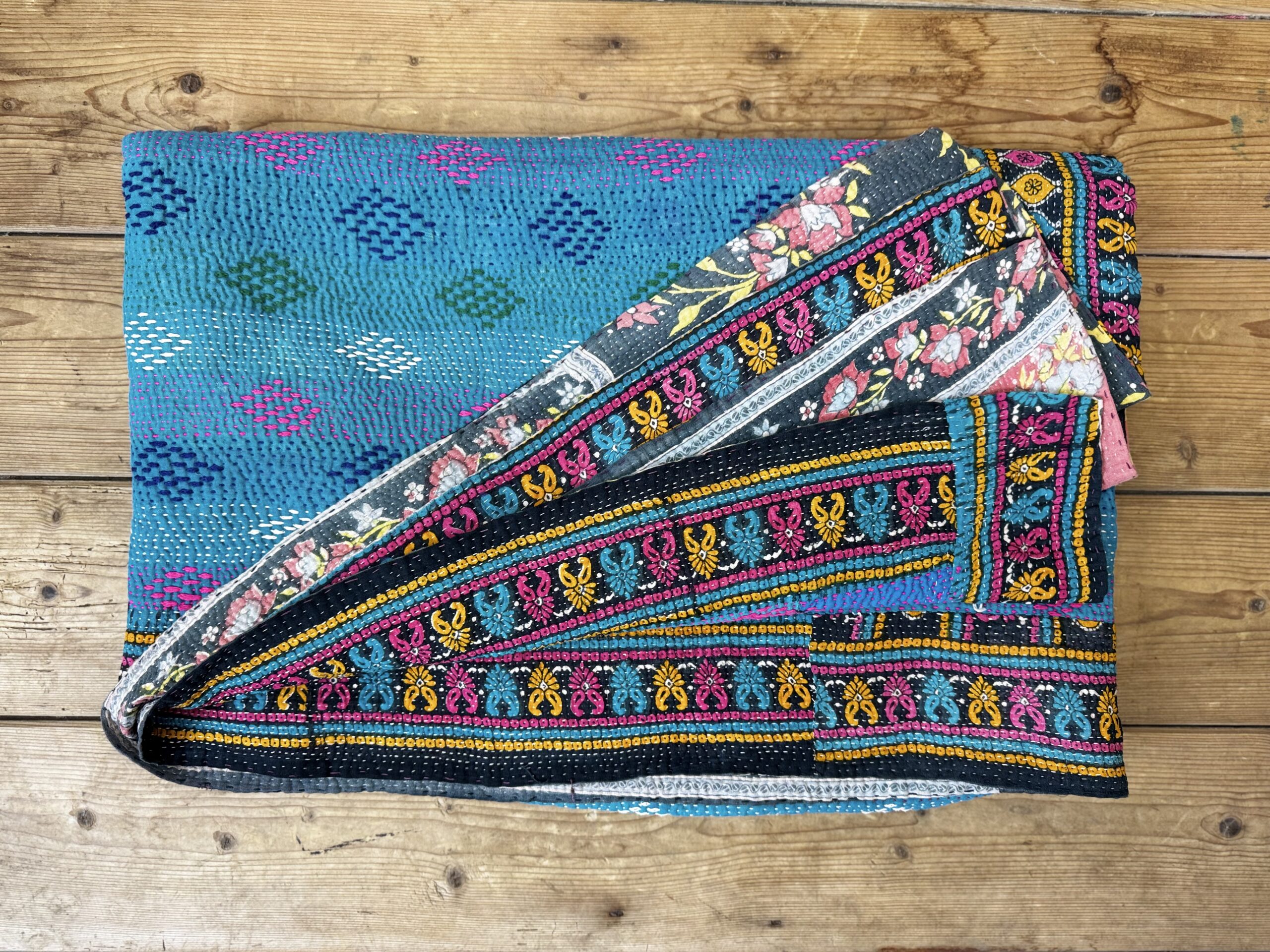 Exquisite vintage Kantha quilt featuring authentic hand-stitched Indian patchwork, responsibly sourced and perfect as unique homeware.