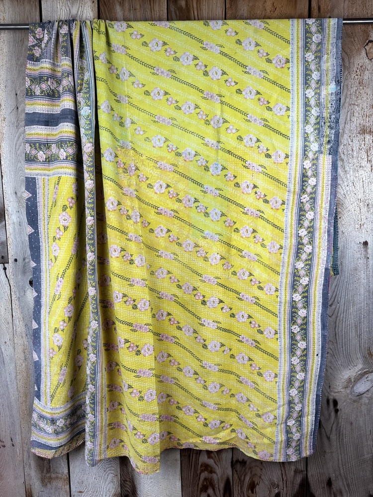 Exquisite vintage Kantha quilt featuring authentic hand-stitched Indian patchwork, responsibly sourced and perfect as unique homeware.