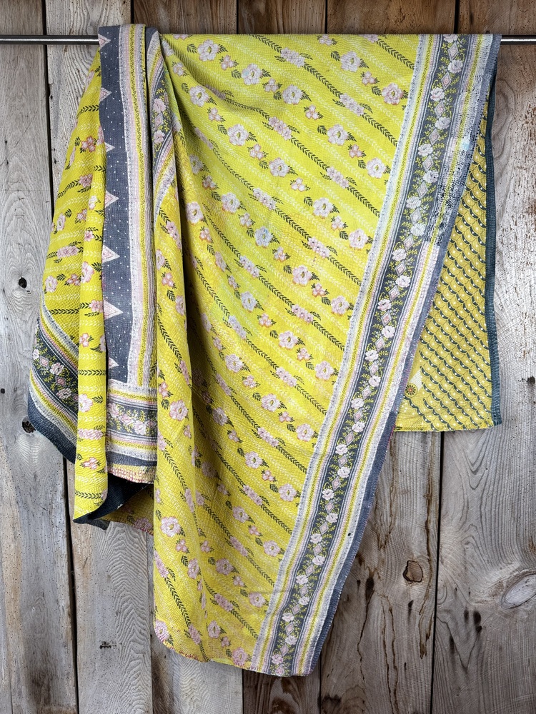 Exquisite vintage Kantha quilt featuring authentic hand-stitched Indian patchwork, responsibly sourced and perfect as unique homeware.