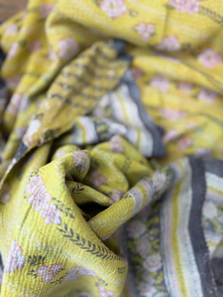 Exquisite vintage Kantha quilt featuring authentic hand-stitched Indian patchwork, responsibly sourced and perfect as unique homeware.