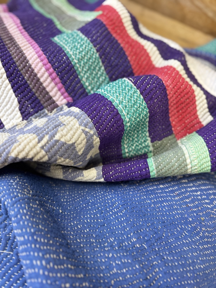 Exquisite vintage Kantha quilt featuring authentic hand-stitched Indian patchwork, responsibly sourced and perfect as unique homeware.