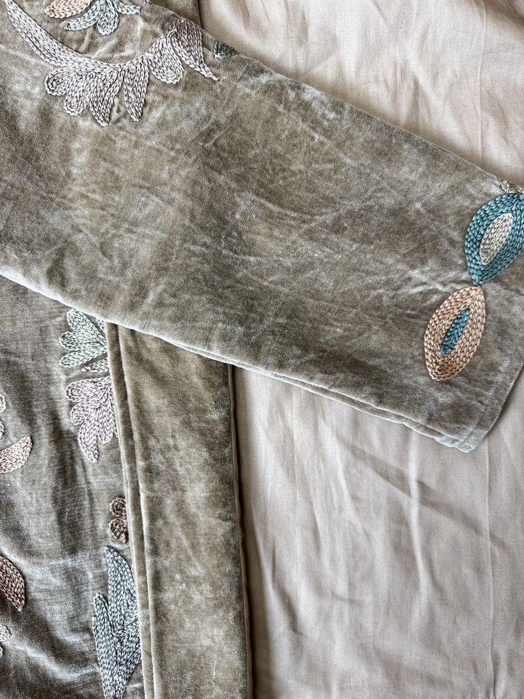 Hand embroidered cotton velvet jacket with soft texture, cosy easy fit, and intricate artisanal detailing.