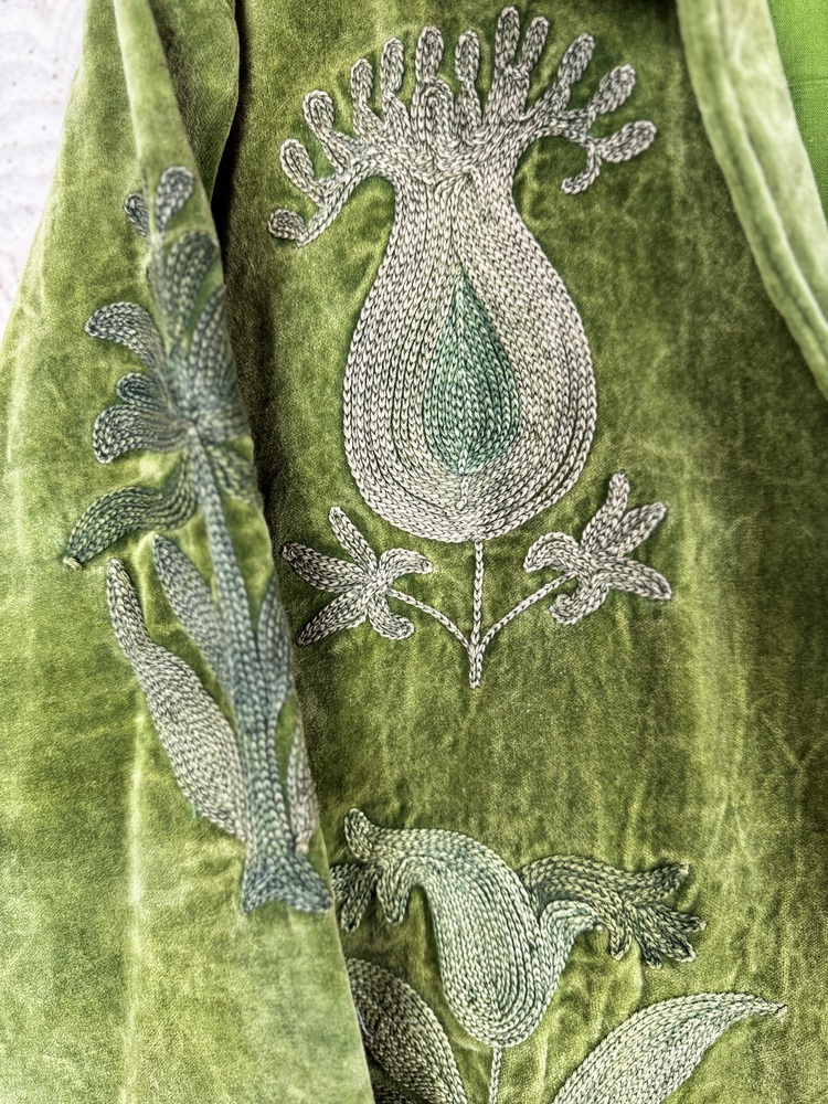 Hand embroidered cotton velvet jacket with soft texture, cosy easy fit, and intricate artisanal detailing.