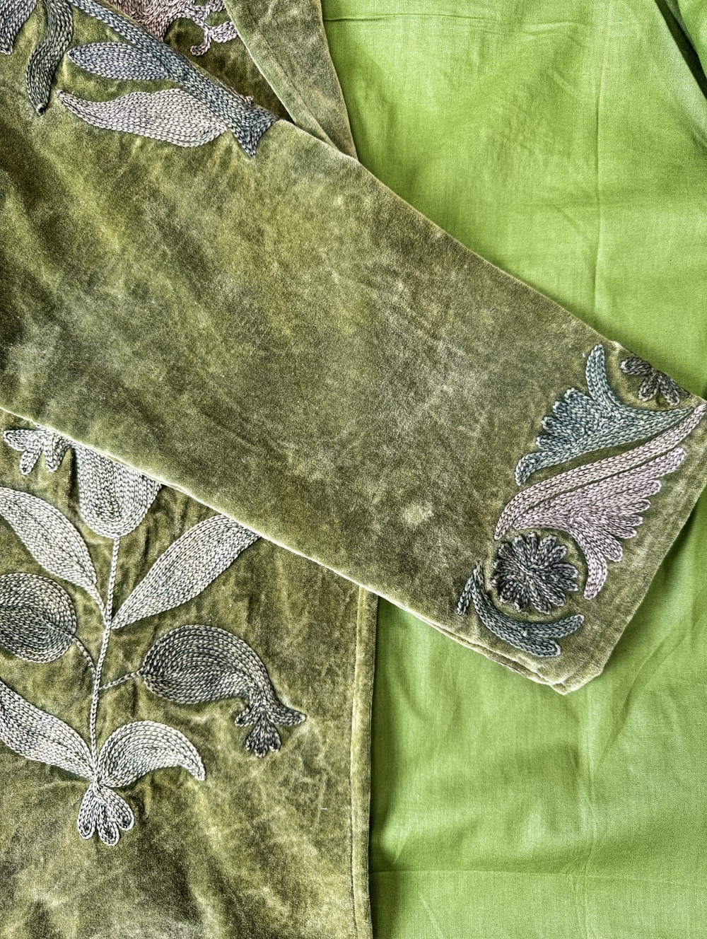 Hand embroidered cotton velvet jacket with soft texture, cosy easy fit, and intricate artisanal detailing.