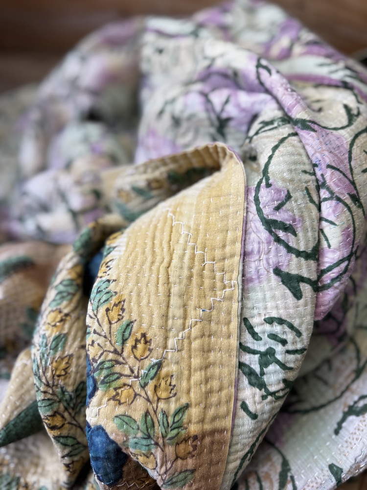 Exquisite vintage Kantha quilt featuring authentic hand-stitched Indian patchwork, responsibly sourced and perfect as unique homeware.