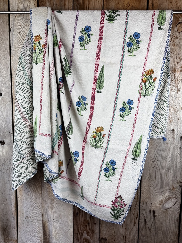 Exquisite vintage Kantha quilt featuring authentic hand-stitched Indian patchwork, responsibly sourced and perfect as unique homeware.