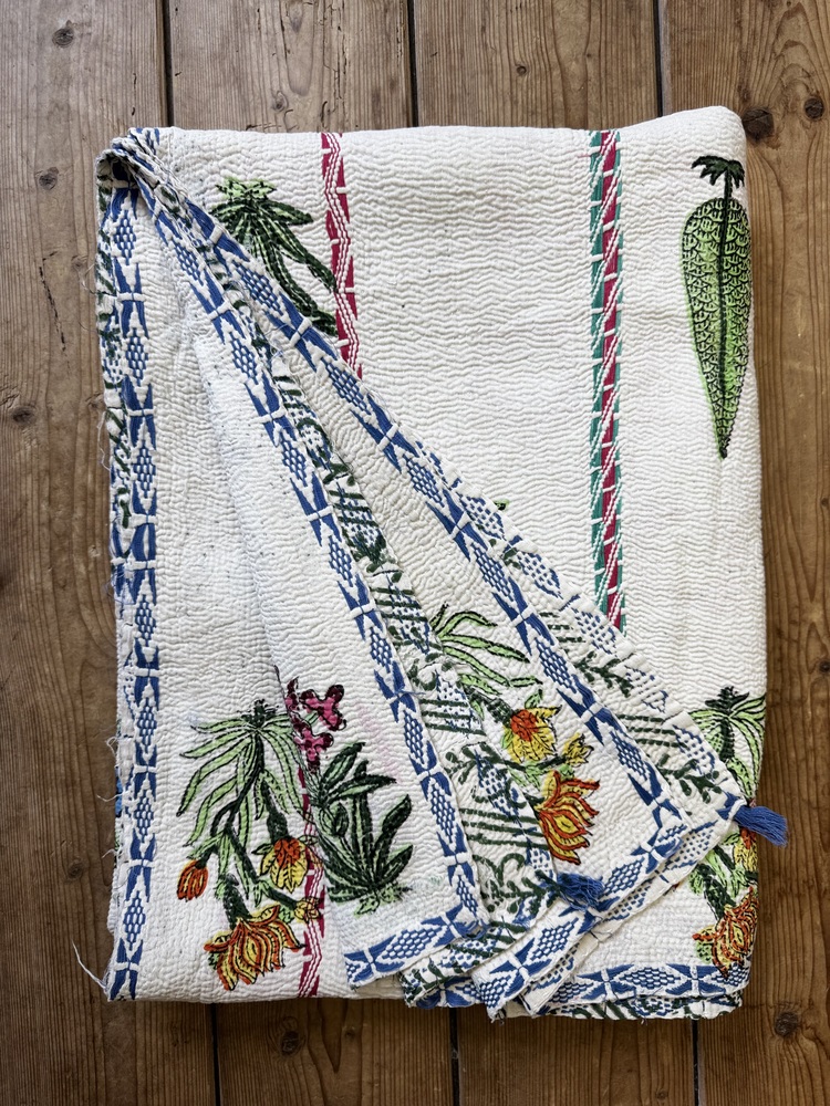 Exquisite vintage Kantha quilt featuring authentic hand-stitched Indian patchwork, responsibly sourced and perfect as unique homeware.