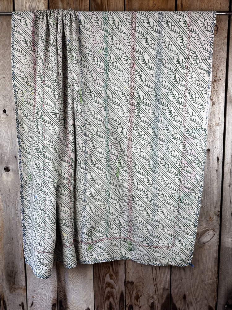 Exquisite vintage Kantha quilt featuring authentic hand-stitched Indian patchwork, responsibly sourced and perfect as unique homeware.