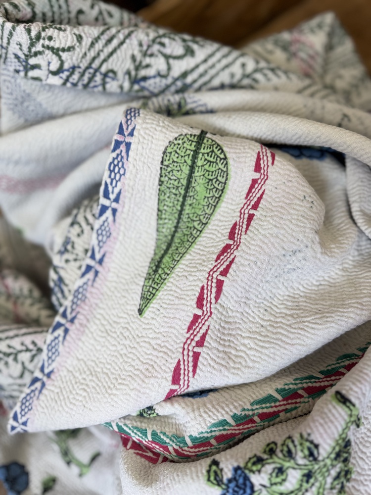 Exquisite vintage Kantha quilt featuring authentic hand-stitched Indian patchwork, responsibly sourced and perfect as unique homeware.