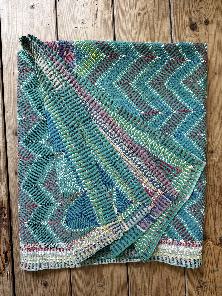 Exquisite vintage Lohori Kantha quilt featuring authentic hand-stitched Indian patchwork, responsibly sourced and perfect as unique homeware.