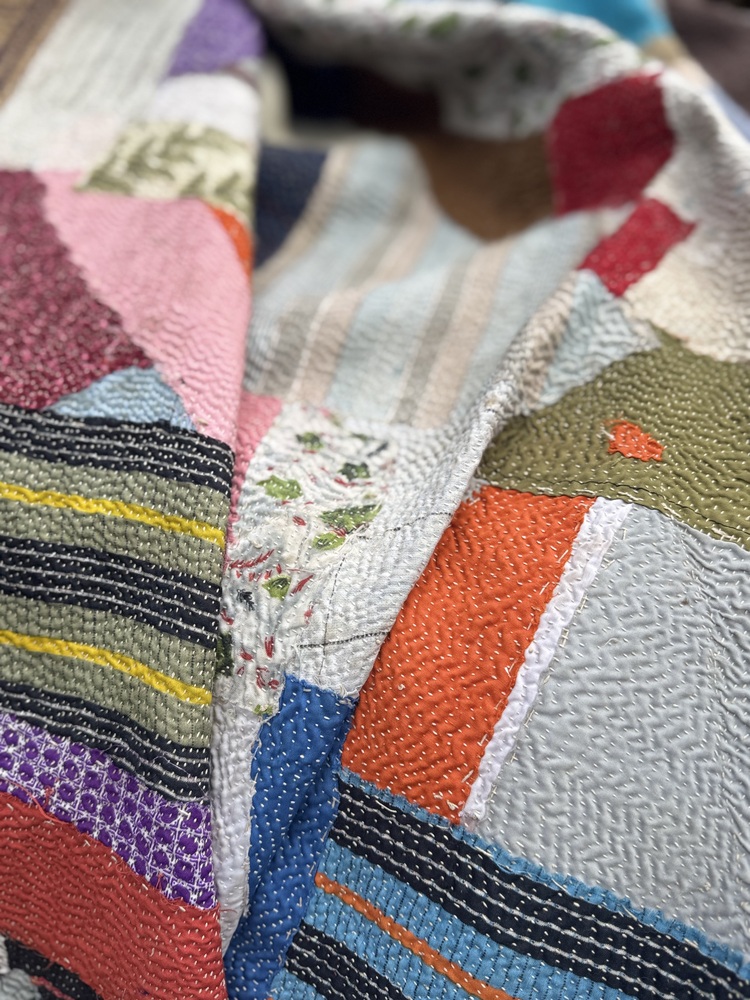 Exquisite vintage Kantha quilt featuring authentic hand-stitched Indian patchwork, responsibly sourced and perfect as unique homeware.